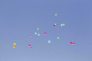 Multicolored balloons against the blue sky.Multicolored balloons photo