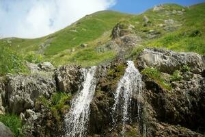 Beautiful waterfall on the mountain with blue sky Waterfall in tropical highlands. photo