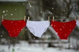 In winter, panties dry on a rope outside. photo