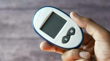 hand hold a diabetic measurement tools close up video