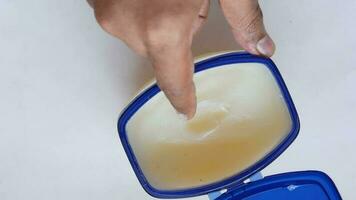 top view of man hand using petroleum jelly video