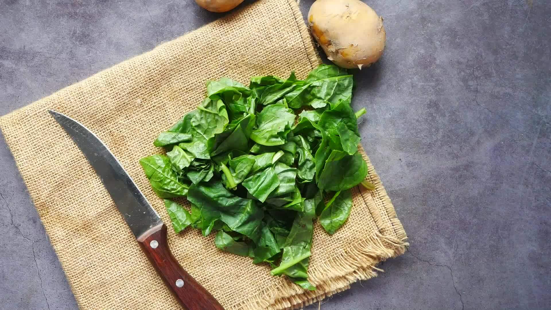 spinach and potatoes on a cloth on a table 26456436 Stock Video at Vecteezy