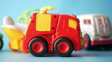 a group of toy trucks on a blue background video