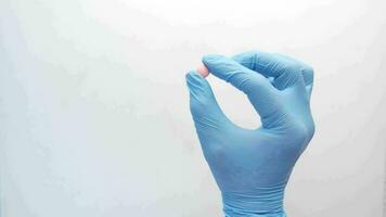Close up of man hand in latex gloves holding medical tablet with copy space video