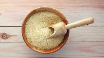 rice in a wooden bowl on a wooden table video