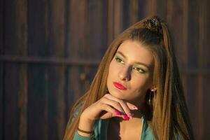 Portrait of a beautiful brunette girl with bright makeup. photo