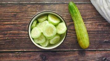 close up of slice of cucumber in a bowl on table video