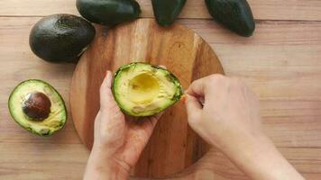 close up of slice of avocado on chopping board video