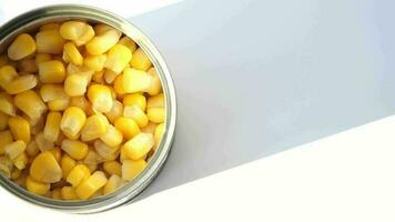 a tin of corn on a white background video