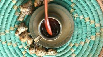 Top view of ginger tea on wooden background video