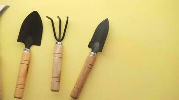 a group of gardening tools on a yellow background video