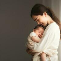 mother stood and held a baby in her arms photograph photo