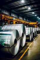 Rolls of steel in factory with conveyor belt in the background. photo