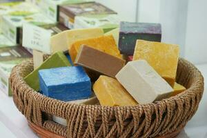 colorful different natural soap bar in a brown wicker photo