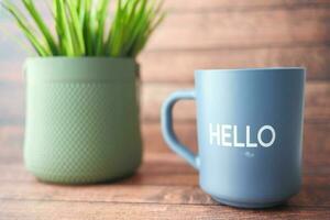 blue coffee cup with hello word photo