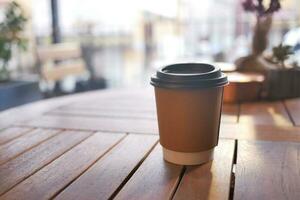 Blank take away kraft coffee cup on table , photo