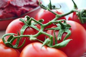 Tomato paste with ripe tomatoes. photo