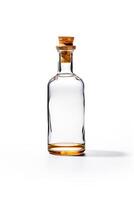 Glass bottle with corked top sitting on white surface with white background. photo