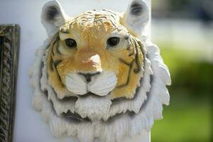 Framed plaster sculpture of a tiger. photo