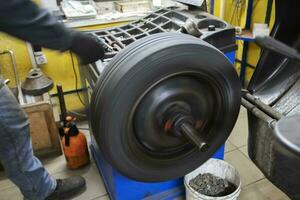 Car wheel repair in a tire workshop. photo