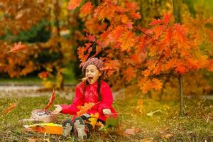 Autumn portrait of cute little caucasian girl photo