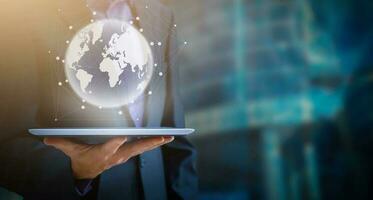 Businessman using tablet analyzing sales data and economic growth graph chart, Technology and icon customer global network connection. Business strategy. Innovative. Digital marketing photo
