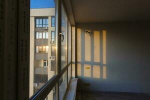 Interior renovated balcony of multistory apartment house photo