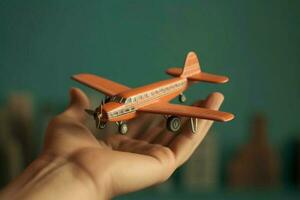 close up photo of male hand holding toy airplane against blue sky . image is retro filtered Generative AI