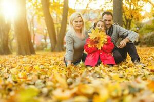 family in the autumn park, forest. photo