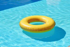 Colorful inflatable tube floating in swimming pool, summer vacation concept photo