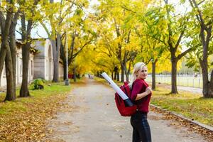 Engineer woman and the project in the forest during day time with copy space photo