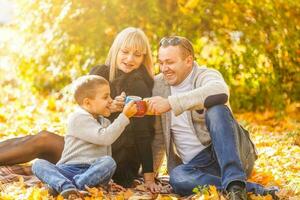 Happy Family in Autumn Park. Picnic photo