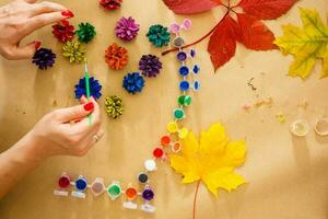 paint for coloring leaves and cones. Autumn background about creativity, return to school. Save the space back to school photo