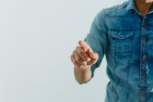 hand presses the index finger on the touchscreen. Button on the touchscreen photo