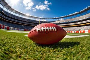 American football stadium full of fans in the stands with ball ready for kickoff or field goal on the field. Deliberate focus on foreground and copy space. photo