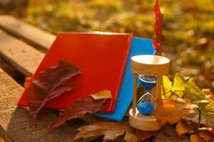 Clock, Hourglasses and Autumn Leaves photo