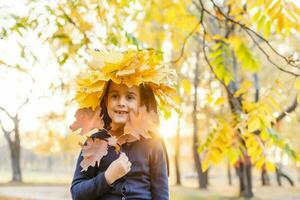 happy little child, girl laughing and playing in the autumn on the nature walk outdoors photo