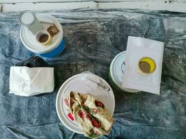 Top view of construction worker desk with things for house renovation. Paintbrush photo