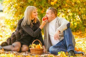 romantic young couple have fun in city park at autumn season photo