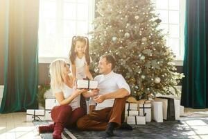 happy family with christmas gift photo