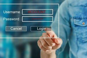 businessman pressing authentication button on login display photo