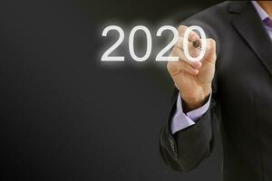 Businessman welcome year 2020. Business new year card concept photo