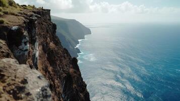 A cliff with a view of the ocean. Generative AI photo