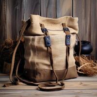 Handmade bag made of natural burlap in a rustic style. Jute shopper on a wooden background. Needlework. Eco bag, modern design. To advertise eco textile and eco life. photo
