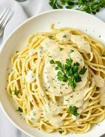 Spaghettis with cream sauce and mushroom photo