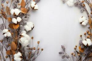 Autumn composition. Frame made of eucalyptus branches, flowers photo