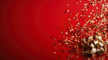 Bottle of champagne with silver confetti on a red background with a place for text photo