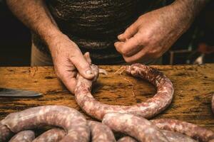 Handmade sausage preparation, Argentine tradition, Pampas, Patagonia photo