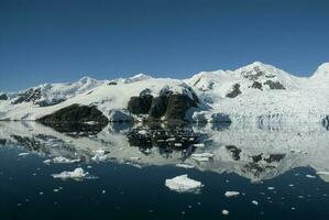 Paraiso Bay mountains landscape, Antartic Pennsula. photo