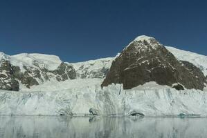 Glaciers and mountains in Paradise bay, Antarctic peninsula, Antartica.. photo